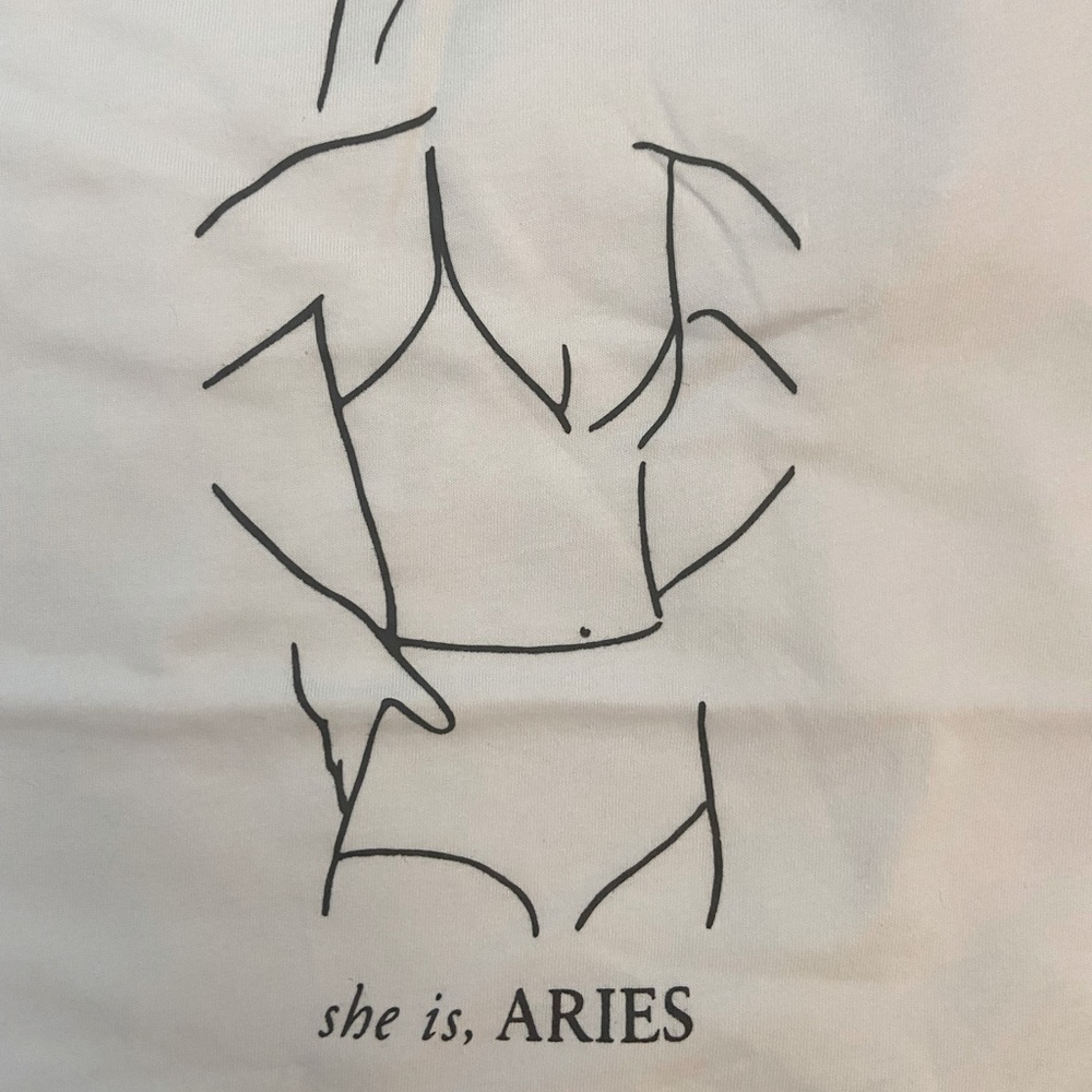 She is Aries Tshirt. NWT. Medium